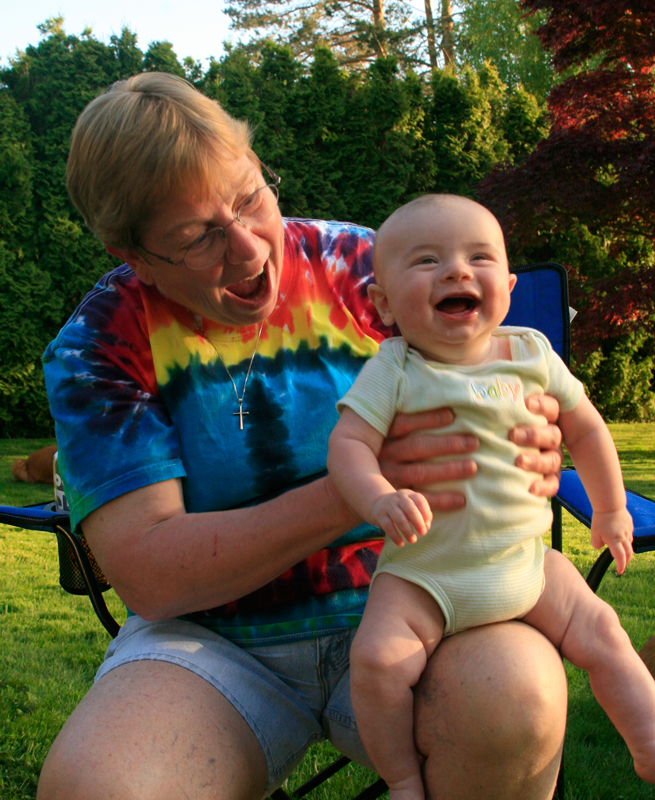 Grandmother with a laughing baby