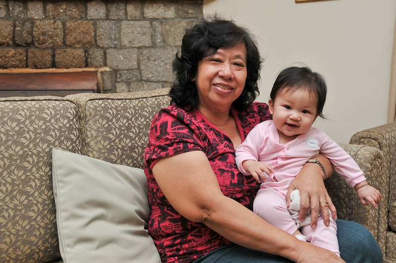 Grandma and granddaughter smiling for the camera