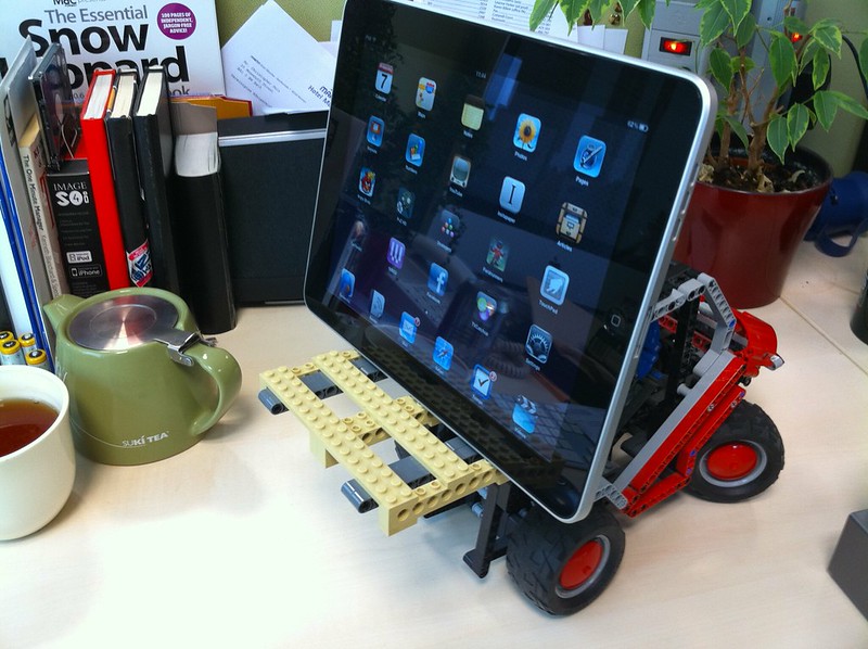 iPad tablet sitting on a toy LEGO truck