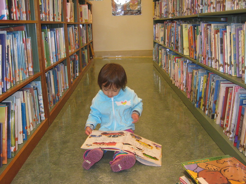 Child reading in the library