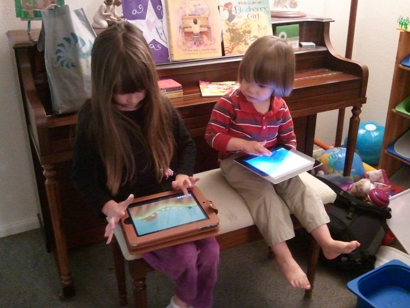 Children playing on tablets