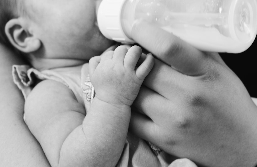 Mother bottle-feeding her baby