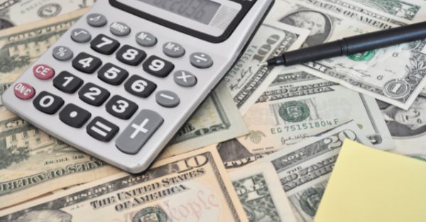 Calculator and U.S. dollar bills
