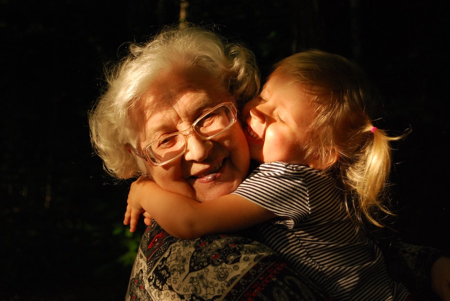 Granddaughter hugging grandmother