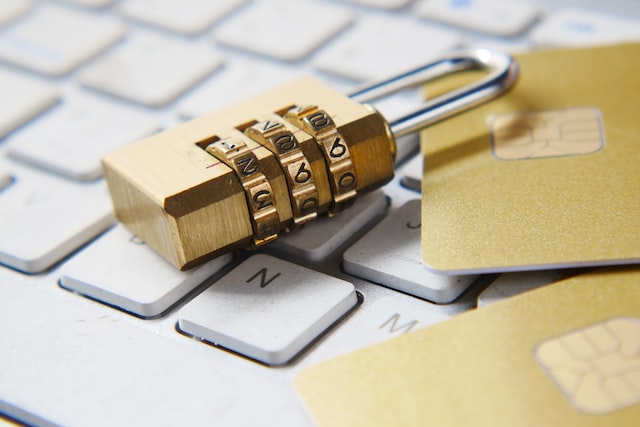 Lock and credit cards on computer keyboard