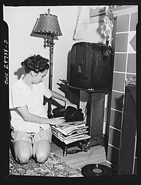 Nancy Fergusen playing a record player attached to the radio
