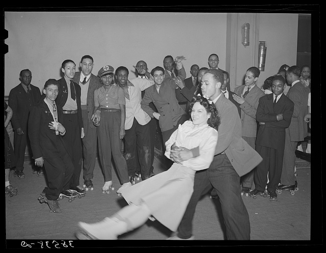 Boy swinging his girl on roller skates. Savoy Ballroom, Chicago, Illinois