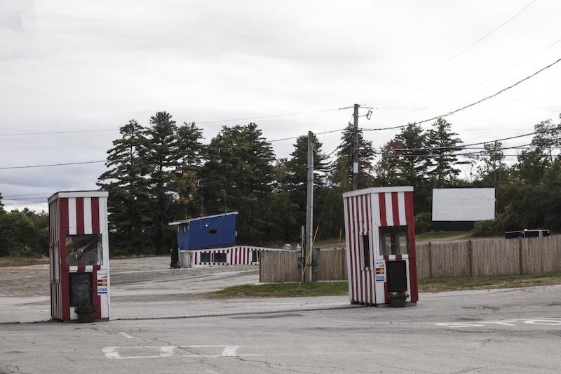 Ticket booths and screen at a drive-in movie theater in Weirs Beach, New Hampshire