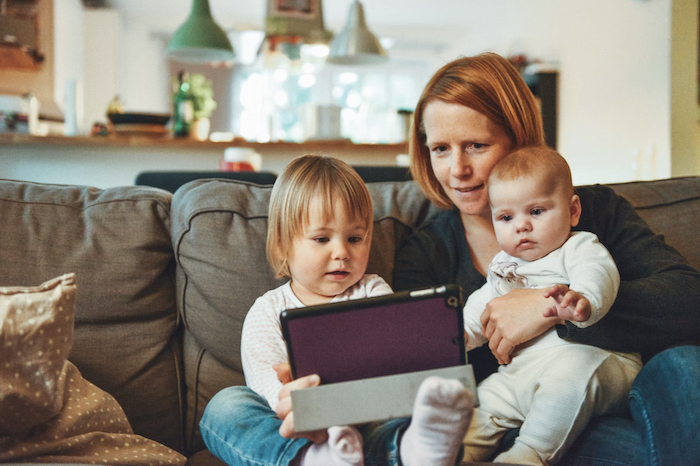 Woman with her children Facetiming
