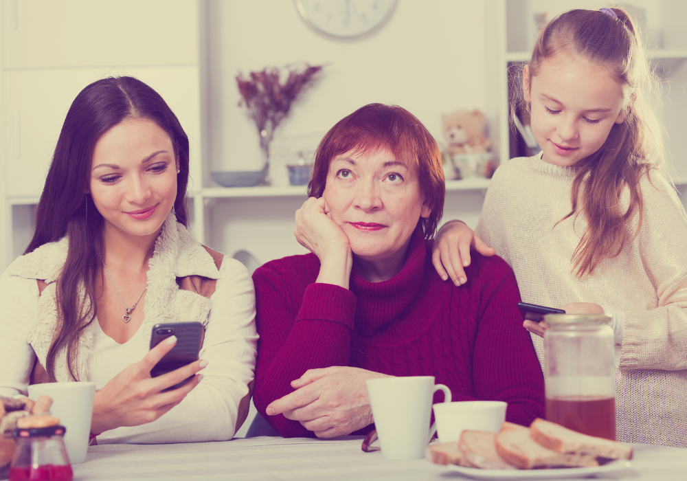 Unamused grandmother with the children on their phones